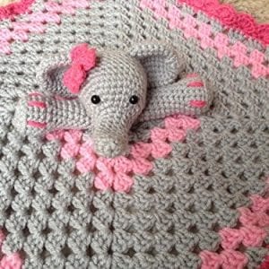 knitted blanket in grey and pink with elephant at the center